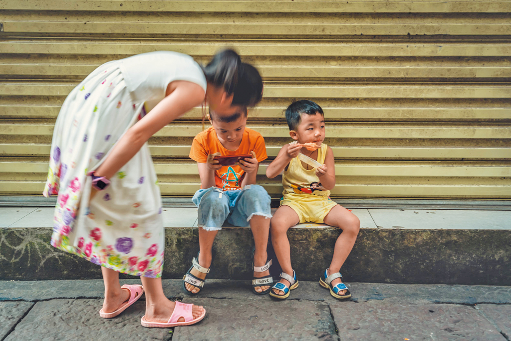 Children spending time on street in China